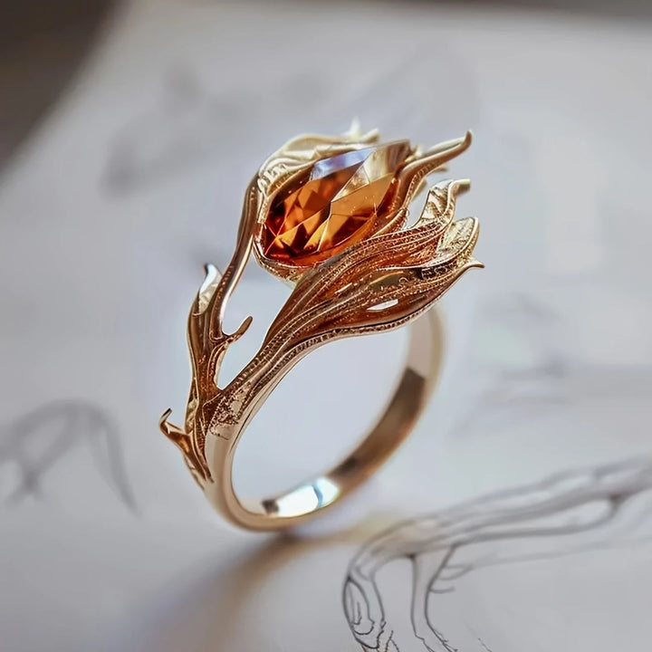 Guldring med orange kristall